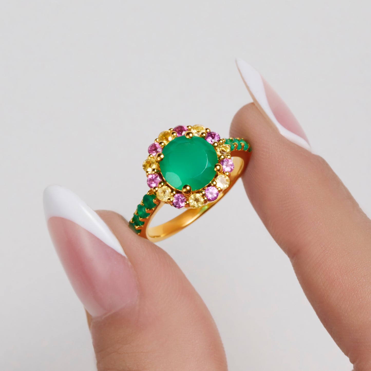 Green onyx rhodolite & citrine gemstone cocktail ring held by model