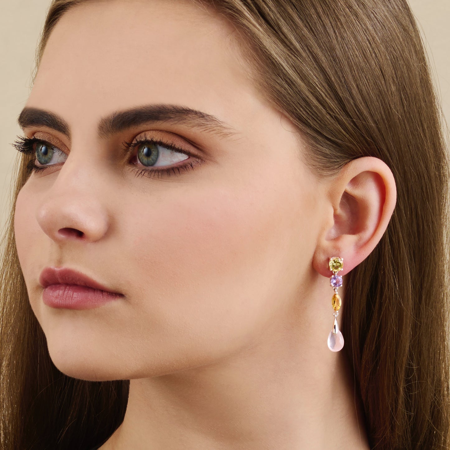 Multi gemstone sterling silver drop earrings close up on model