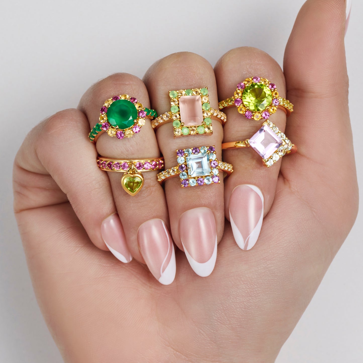 Multi colourful gemstone cocktail rings on models hand