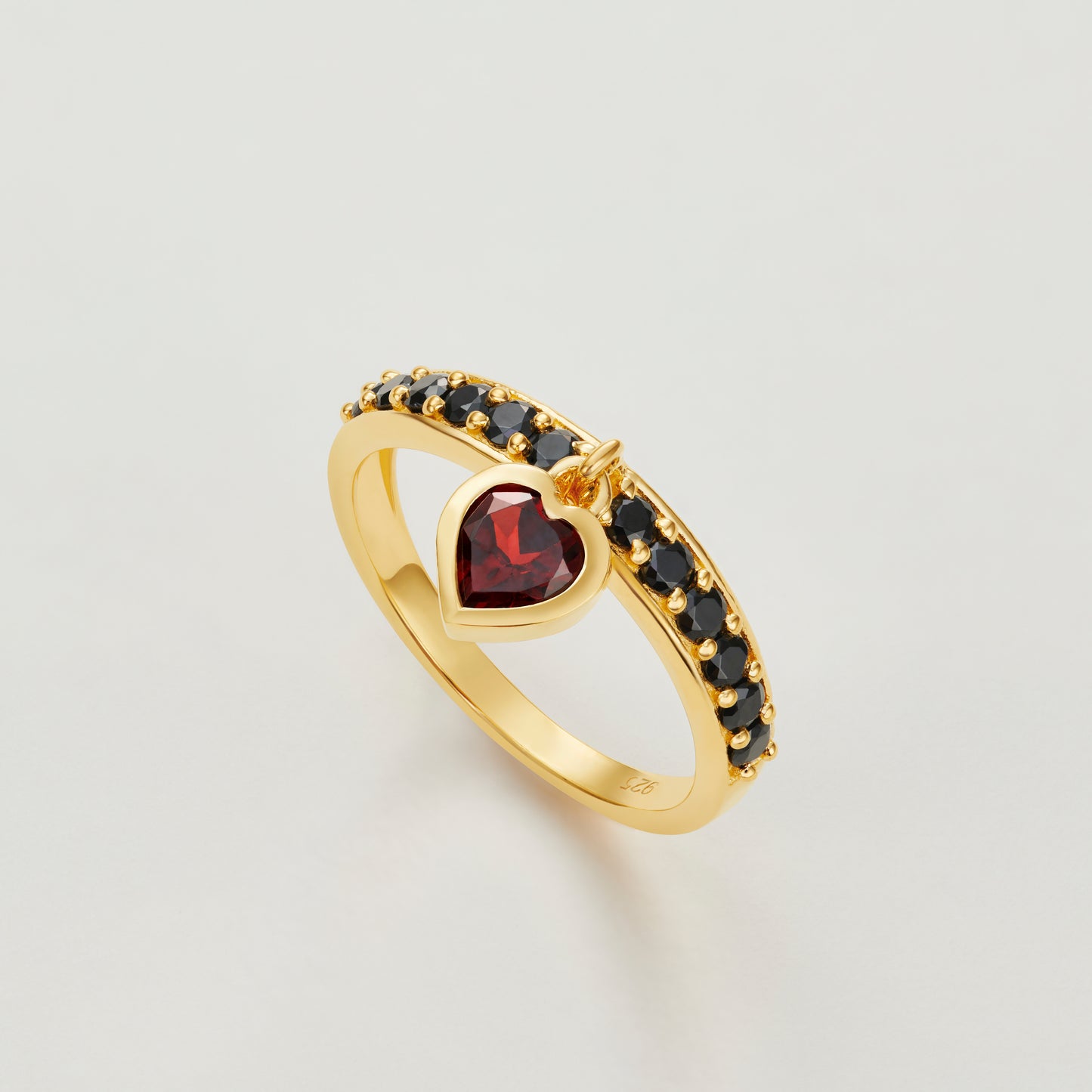 Red garnet and black onyx heart charm ring in gold